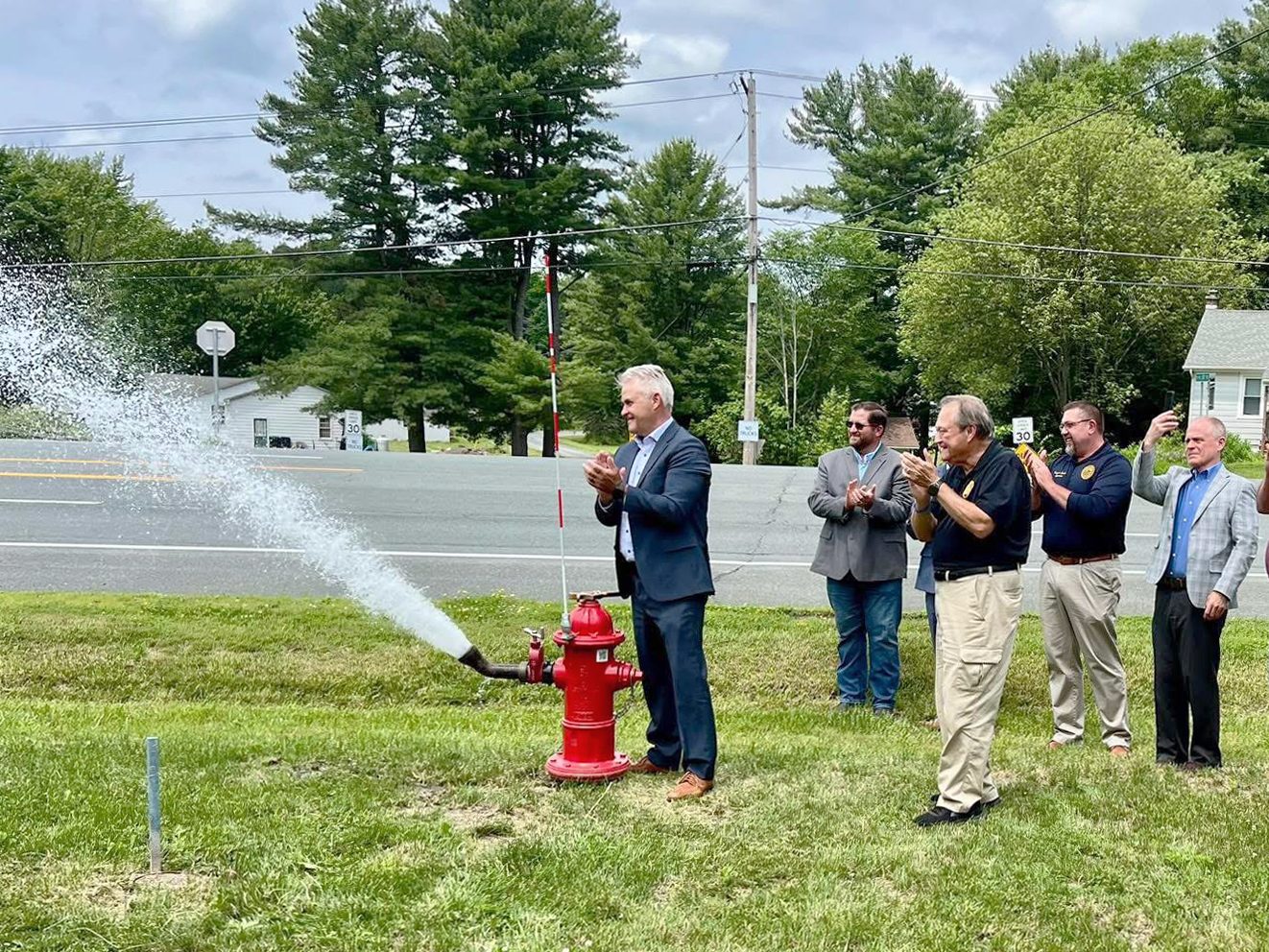 Rensselaer County Executive Steve McLaughlin opens one of the new hydrants as part of the Schodack Rte. 9 South Water Infrastructure Extension opening ceremony